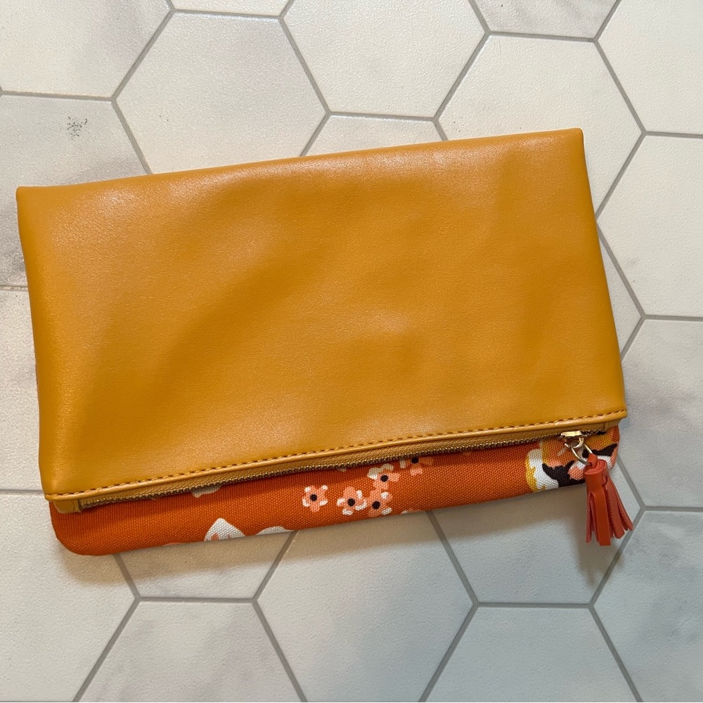 Rachel Pally orange leather and floral fold over clutch with gold hardware